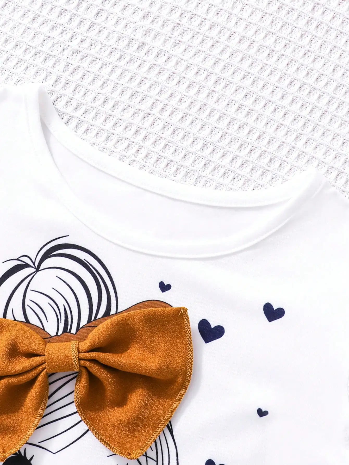Girls Fashion Set: White Cartoon Print T-shirt with Bright Orange Bow Trousers